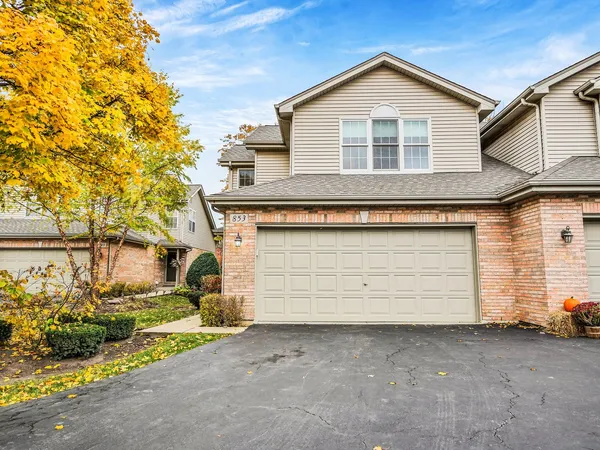 a front view of a house with a garage