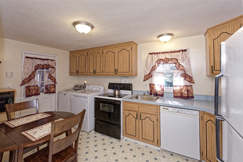 17 Blackman Road Canton, MA 02021 - Photo 11 of 36 a kitchen with a sink stove and cabinets