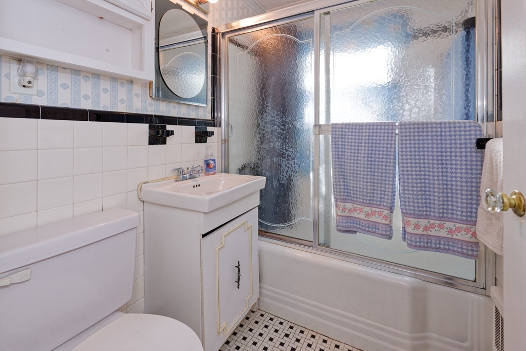 17 Blackman Road Canton, MA 02021 - Photo 21 of 36 a bathroom with a sink a toilet and shower