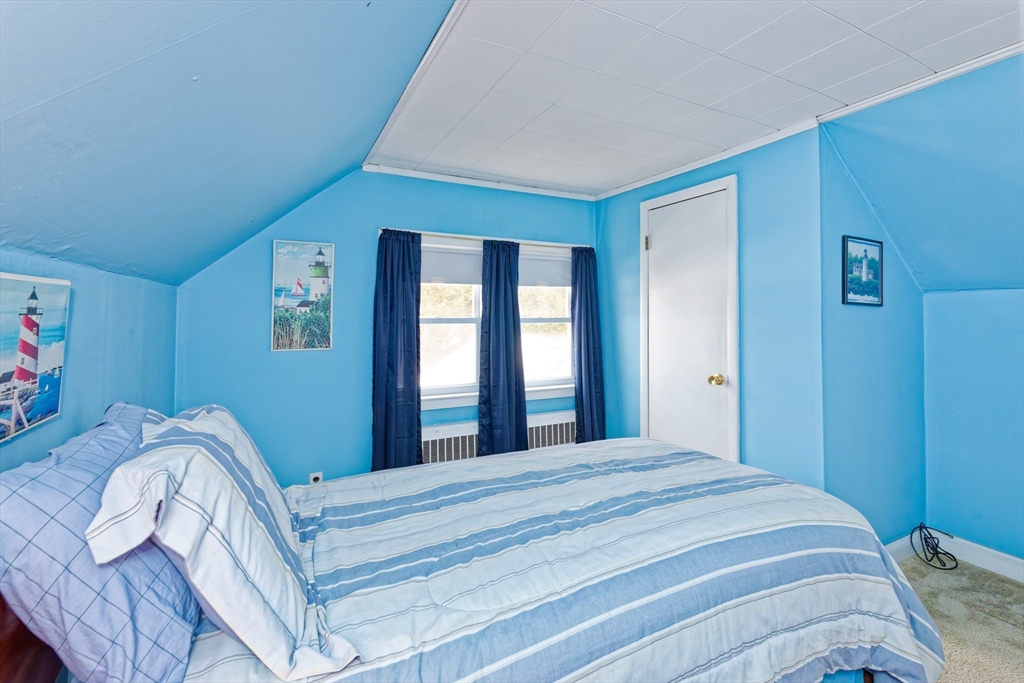 17 Blackman Road Canton, MA 02021 - Photo 23 of 36 a bed sitting in a bedroom next to a window