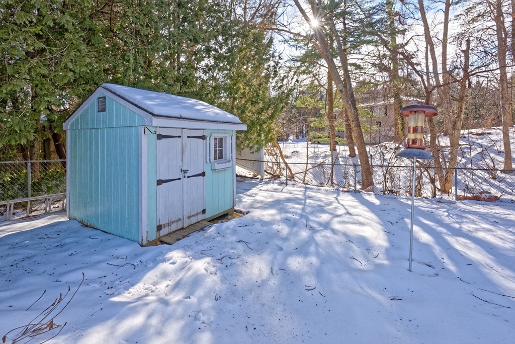17 Blackman Road Canton, MA 02021 - Photo 32 of 36 a view of backyard with a large trees and a wooden fence