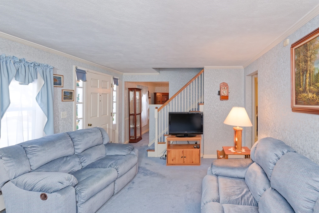 17 Blackman Road Canton, MA 02021 - Photo 4 of 36 a living room with furniture and a flat screen tv