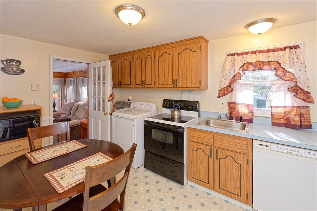 17 Blackman Road Canton, MA 02021 - Photo 9 of 36 a kitchen with a sink stove and cabinets