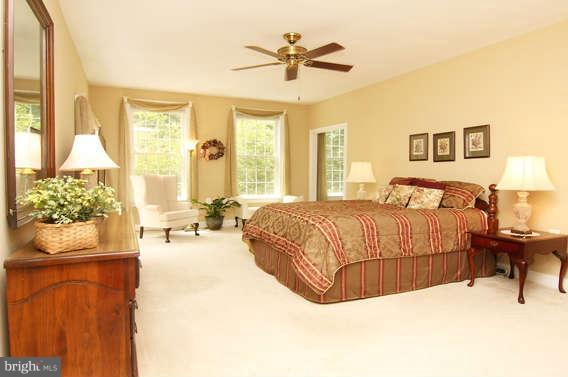 3011 Belford Road Finksburg, MD 21048 - Photo 17 of 30 a bedroom with a bed and wooden floor