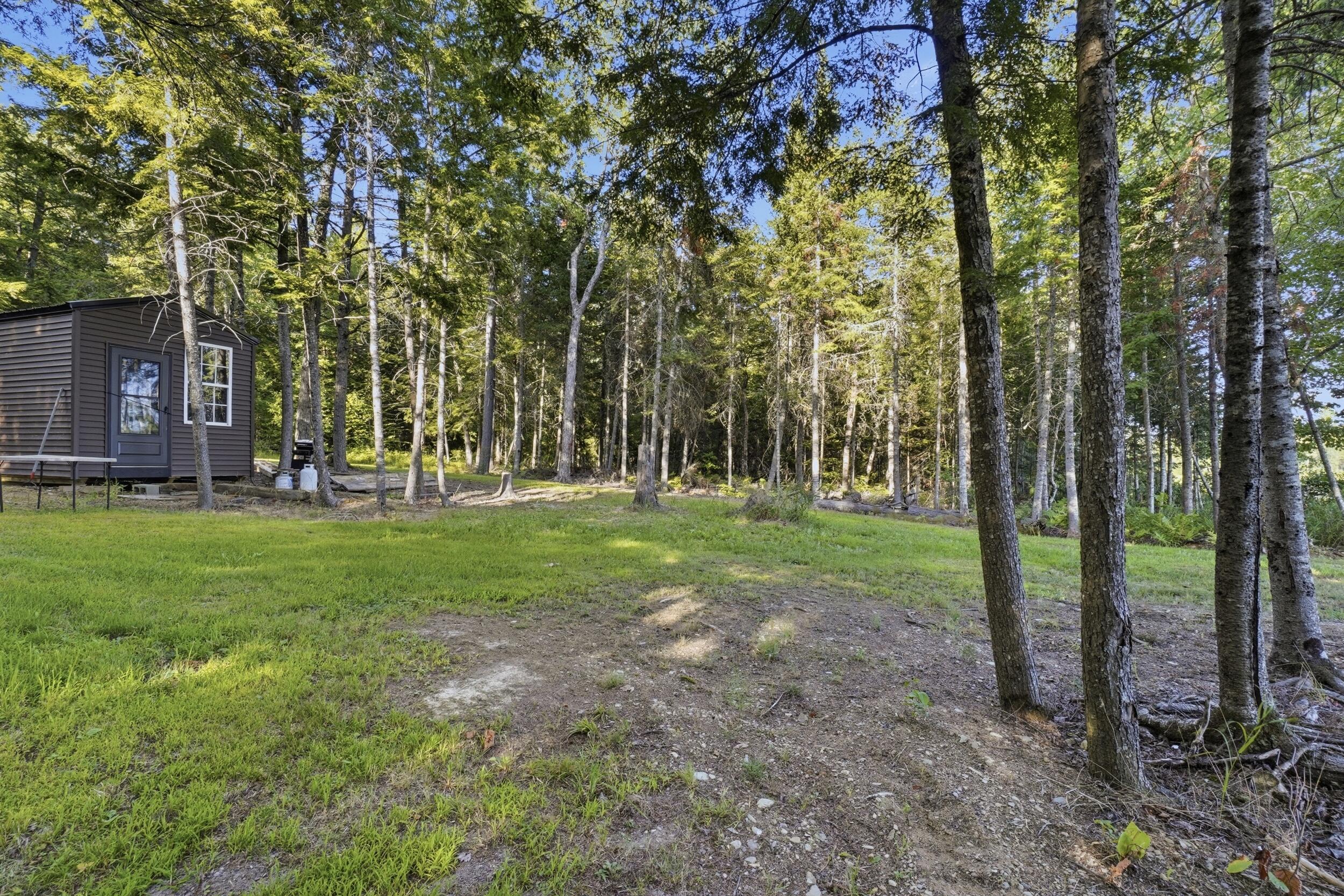 395 Lee Road Lincoln, ME 04457 - Photo 49 of 61 051_395lee_lakeside_camp_exterior_2