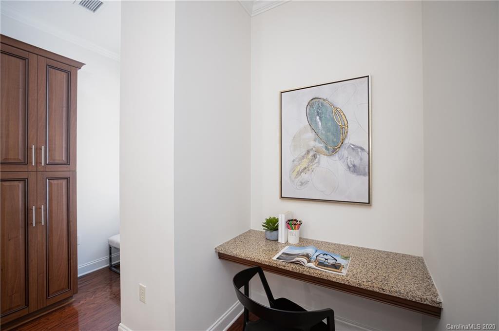 230 South Tryon Street, Unit 305 Charlotte, NC 28202 - Photo 14 of 32 a view of a workspace with furniture