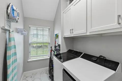 a kitchen that has a stove and a window