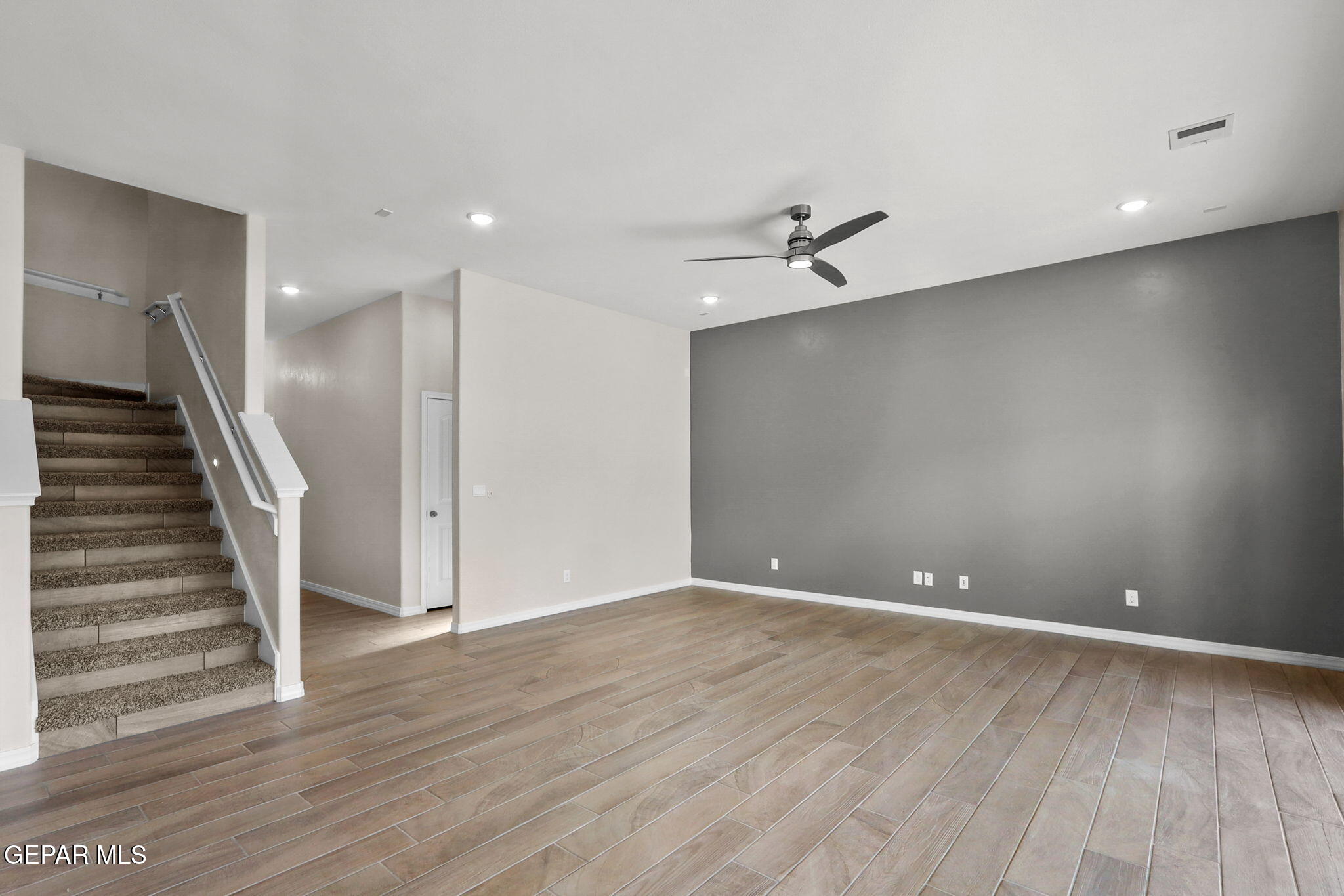 15313 Resolve Drive El Paso, TX 79938 - Photo 16 of 45 an empty room with wooden floor and entryway