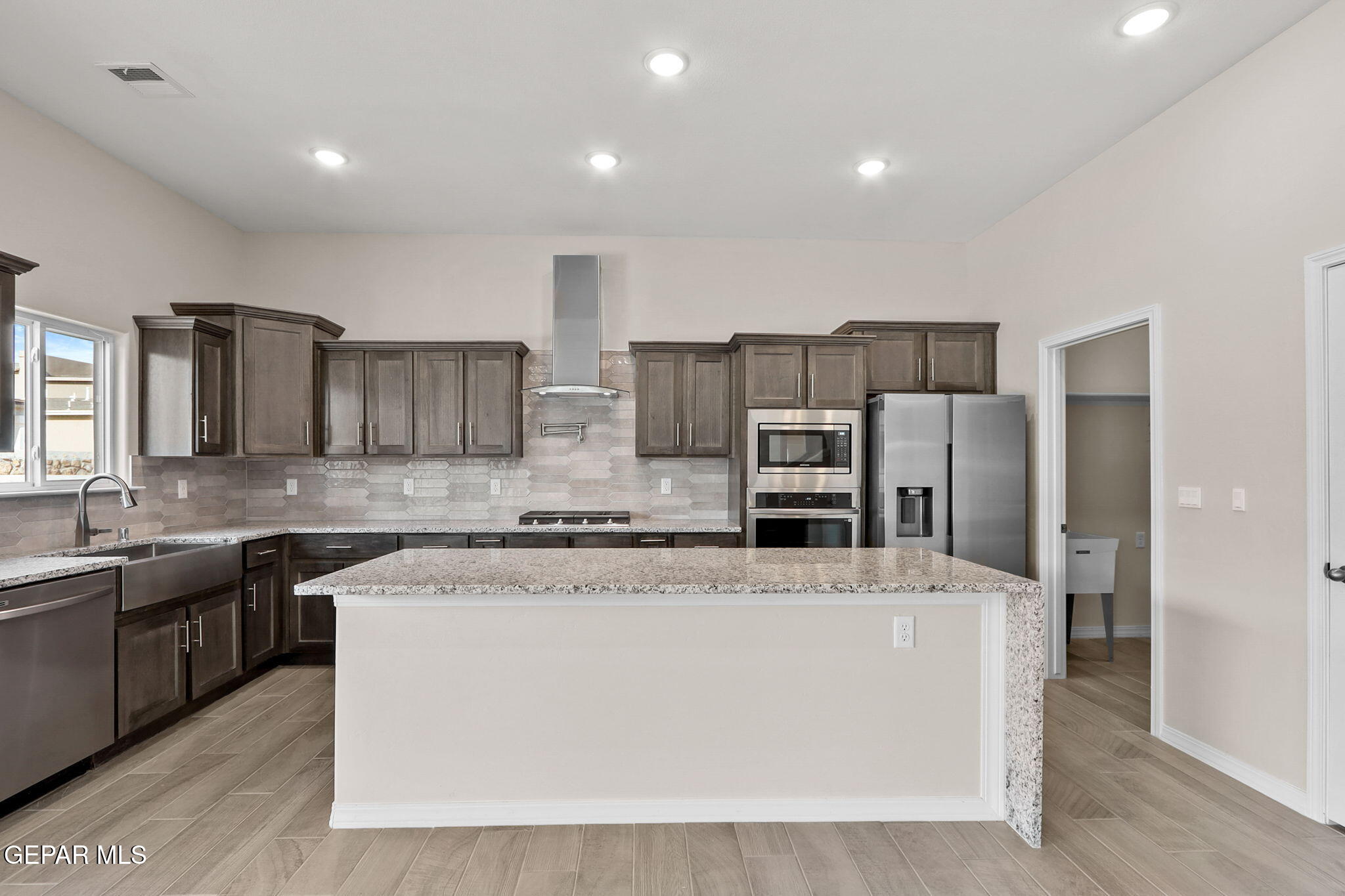 15313 Resolve Drive El Paso, TX 79938 - Photo 20 of 45 a large kitchen with stainless steel appliances and a sink