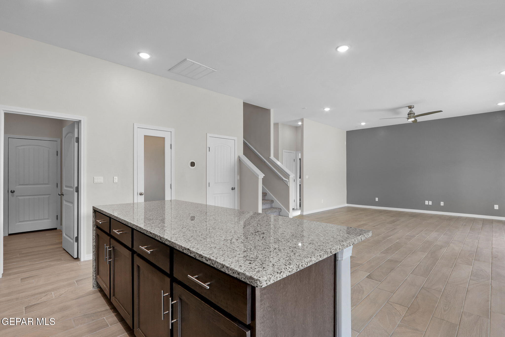 15313 Resolve Drive El Paso, TX 79938 - Photo 26 of 45 a kitchen with granite countertop a sink and cabinets