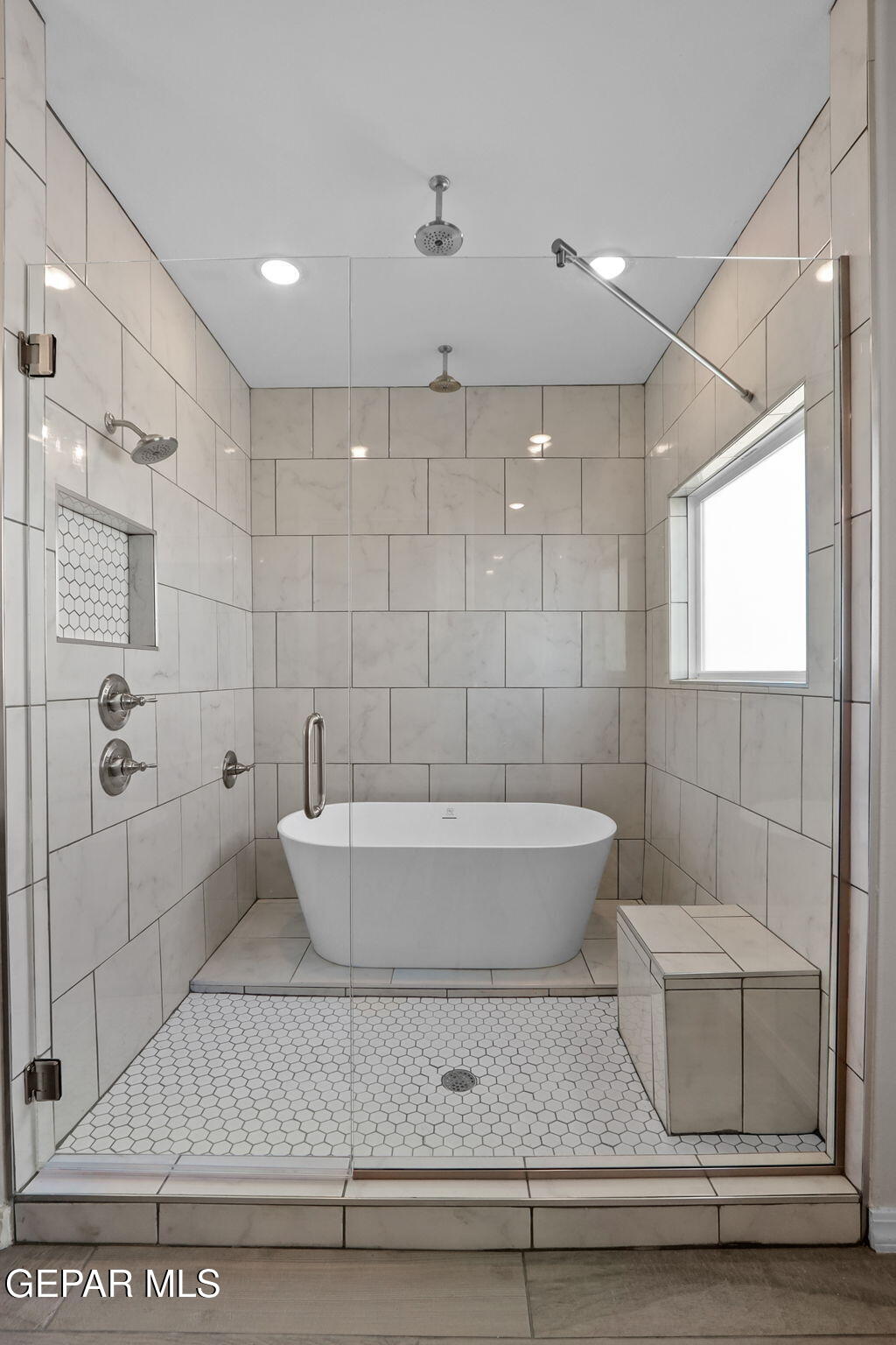 15313 Resolve Drive El Paso, TX 79938 - Photo 43 of 45 a bathroom with a bathtub and shower