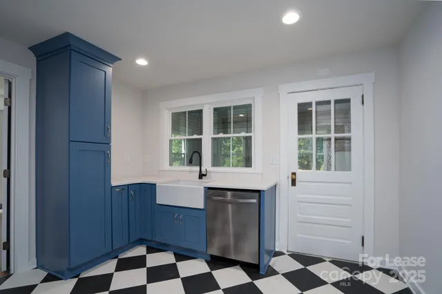 a kitchen with a sink and a window