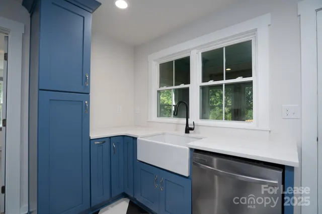 a kitchen with a sink and a window