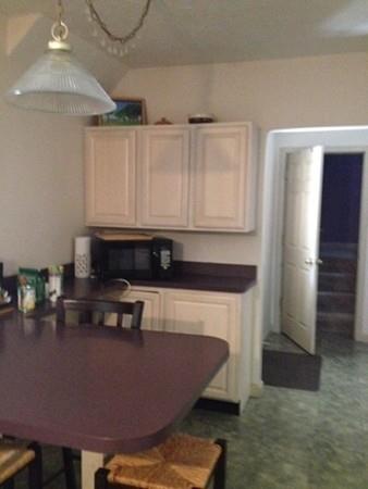 20 Spring Street Ware, MA 01082 - Photo 11 of 41 a living room with furniture and kitchen view