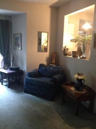 20 Spring Street Ware, MA 01082 - Photo 15 of 41 a living room with furniture and a window