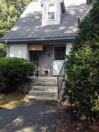 20 Spring Street Ware, MA 01082 - Photo 2 of 41 a front view of a house with a yard garage and outdoor seating