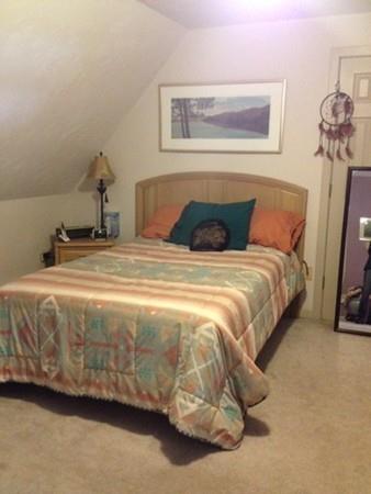 20 Spring Street Ware, MA 01082 - Photo 31 of 41 a bedroom with a bed and a painting on the wall