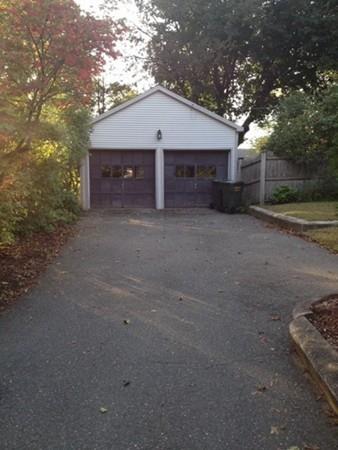 20 Spring Street Ware, MA 01082 - Photo 5 of 41 a front view of a house with a yard and garage