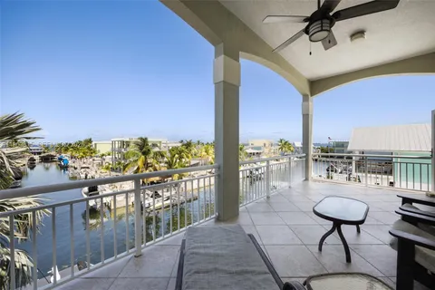 a view of a balcony with chairs