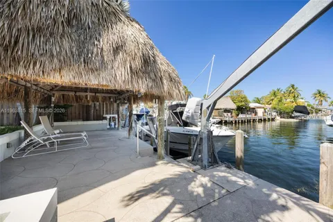 an aerial view of multiple houses with a yard