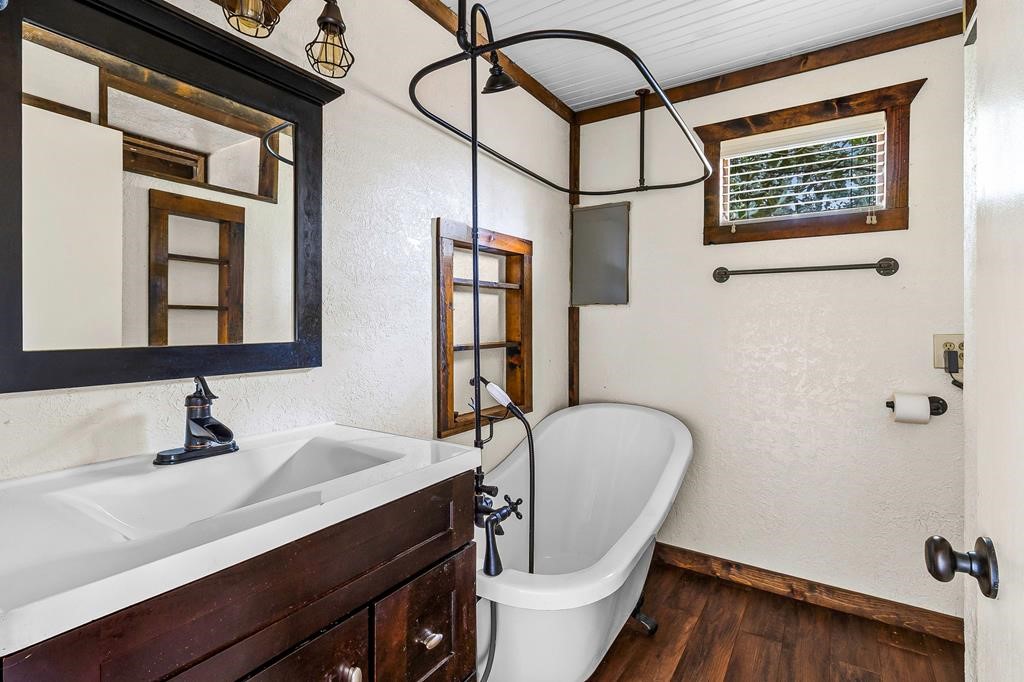 1542 Hillbilly Heaven Road Livingston, TX 77351 - Photo 25 of 27 a bathroom with a sink a toilet and mirror
