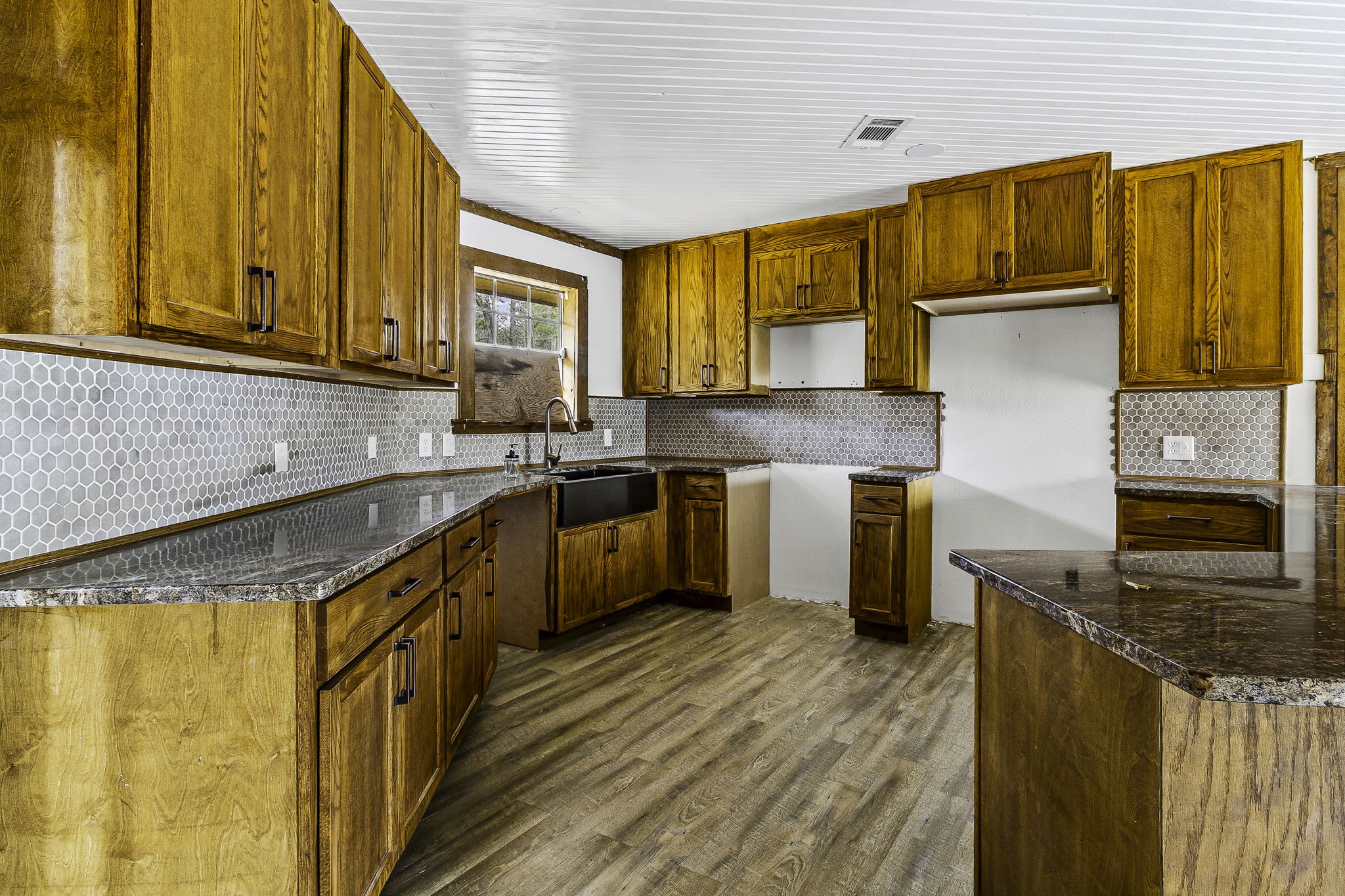 1542 Hillbilly Heaven Road Livingston, TX 77351 - Photo 4 of 27 a kitchen with stainless steel appliances granite countertop a stove a sink dishwasher and a refrigerator