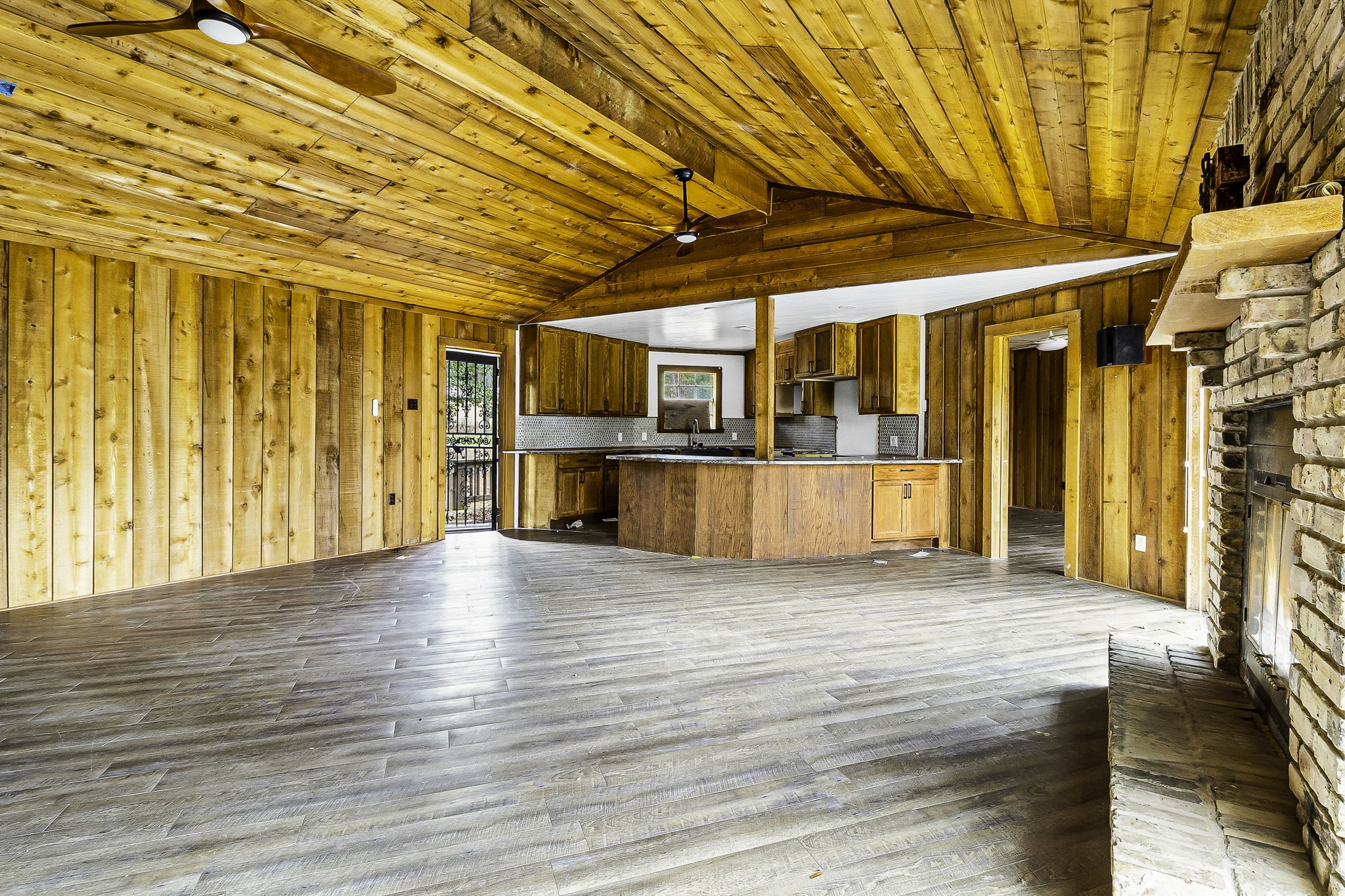 1542 Hillbilly Heaven Road Livingston, TX 77351 - Photo 9 of 27 a view of empty room with wooden floor and door