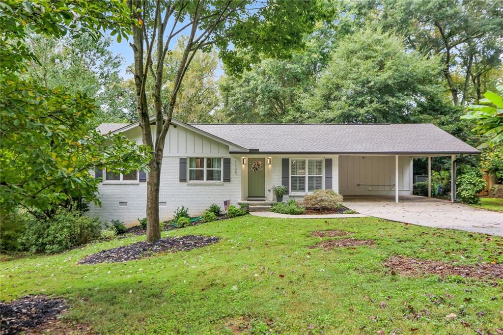 1125 Mayfield Drive Decatur, GA 30033 - Photo 1 of 1 a front view of a house with a yard and porch