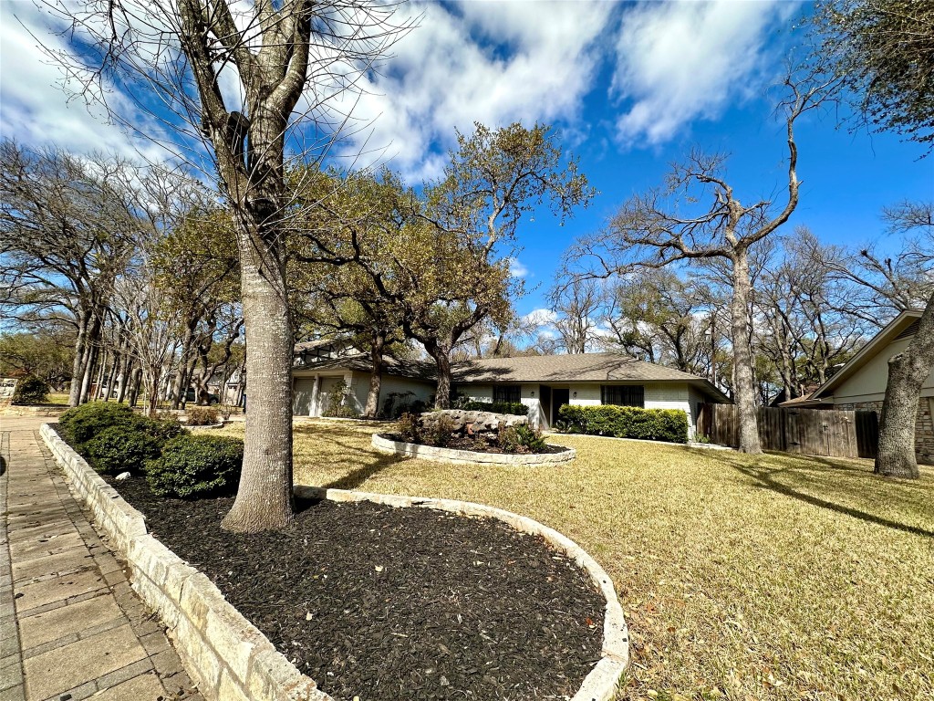 11740 D-K Ranch Road Austin, TX 78759 - Photo 1 of 1 a view of a yard with a tree