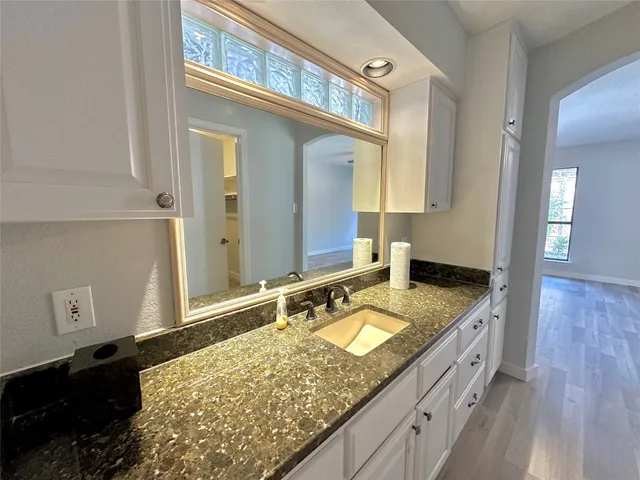 a view of a house with a snow on the road