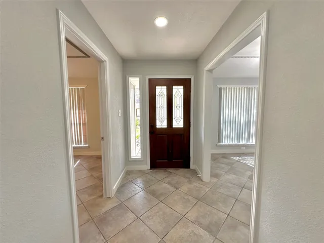 a kitchen with a sink a stove and cabinets