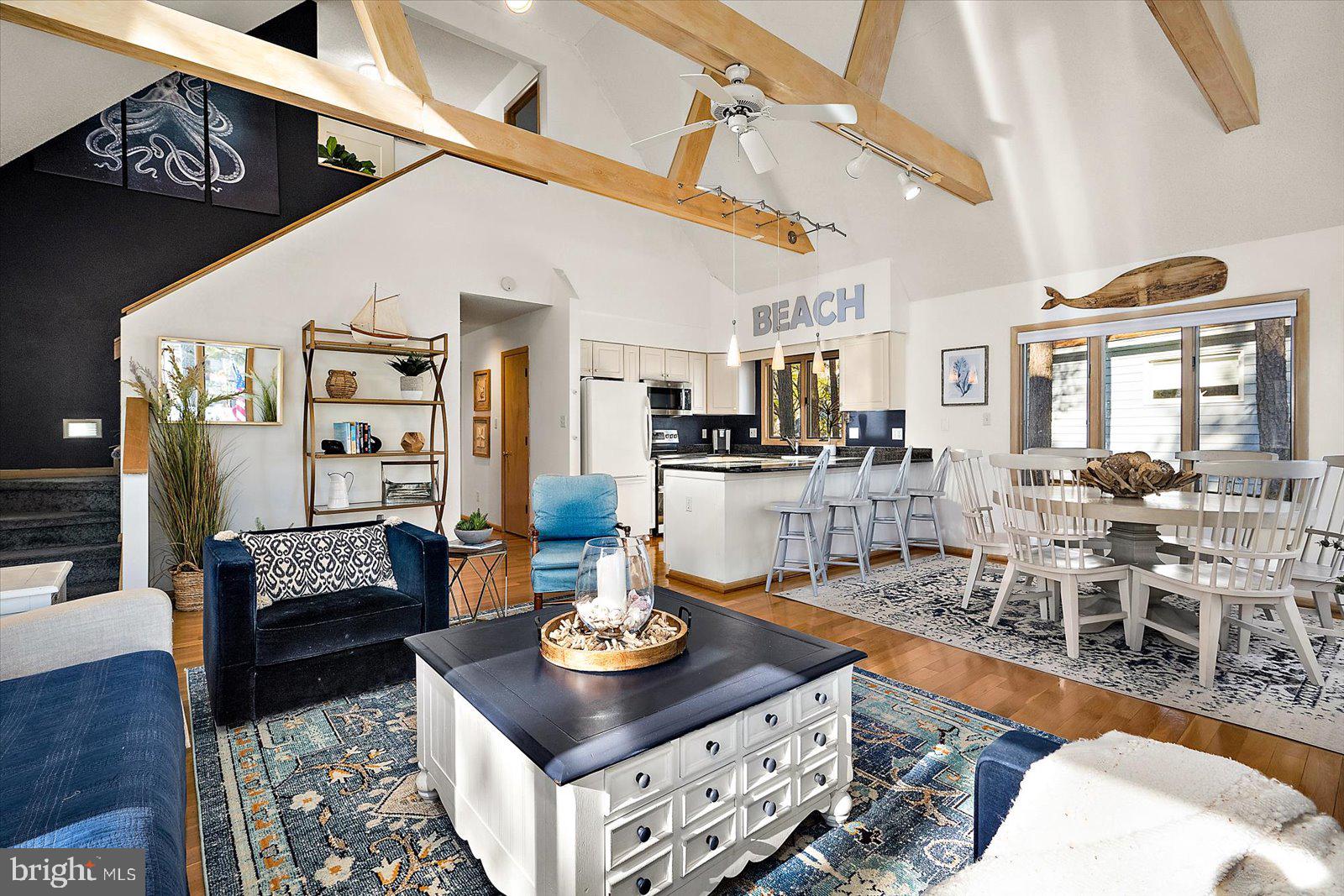 943 Pine Tree Lane Bethany Beach, DE 19930 - Photo 10 of 87 Family room with exposed ceiling beams