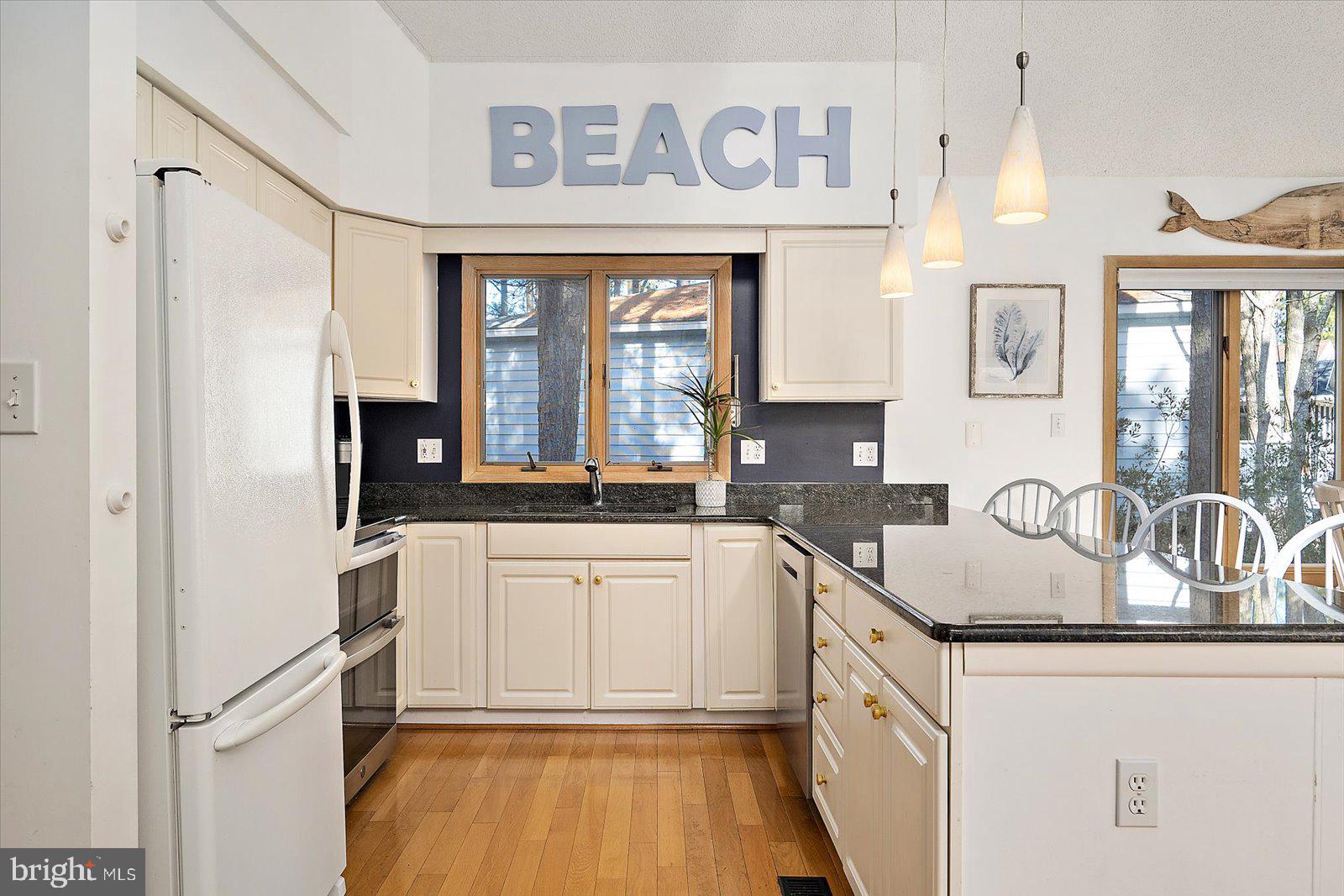 943 Pine Tree Lane Bethany Beach, DE 19930 - Photo 17 of 87 Kitchen with hardwood floors