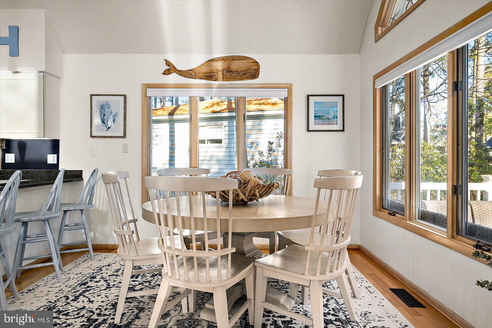943 Pine Tree Lane Bethany Beach, DE 19930 - Photo 20 of 87 Dining area with hardwood floors