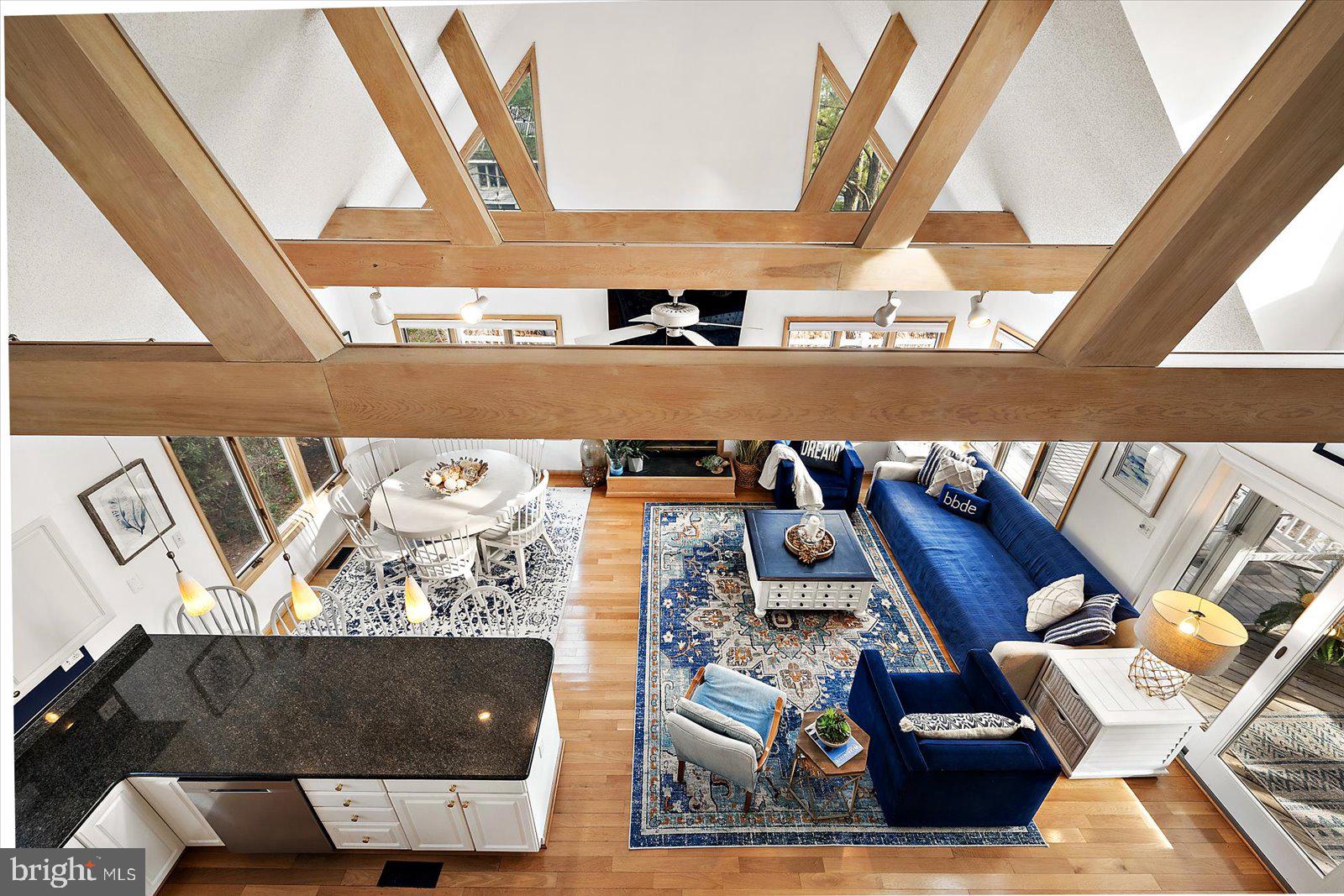 943 Pine Tree Lane Bethany Beach, DE 19930 - Photo 23 of 87 Open concept living area with exposed ceiling beam