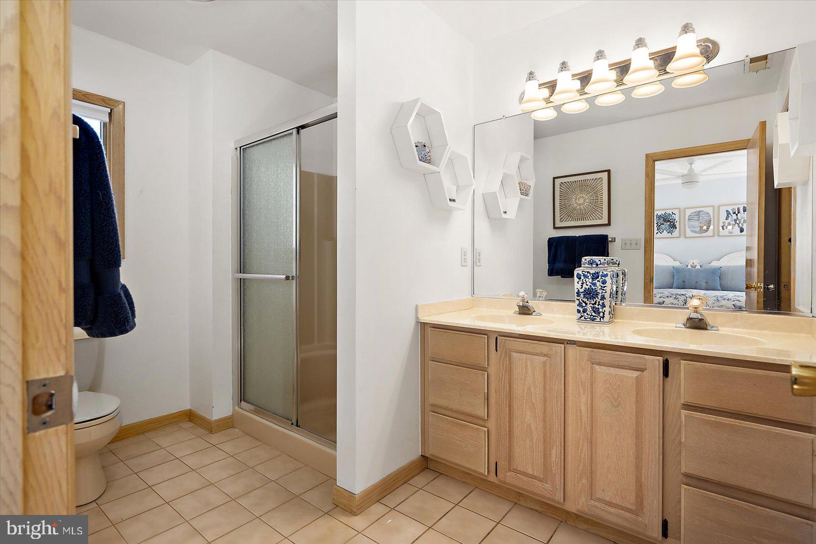 943 Pine Tree Lane Bethany Beach, DE 19930 - Photo 28 of 87 Primary bathroom with double vanity