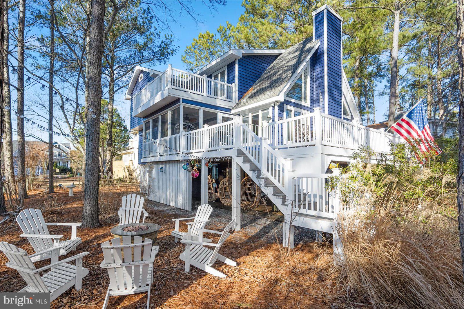 943 Pine Tree Lane Bethany Beach, DE 19930 - Photo 65 of 87 Back yard with cozy fireplace and custom lighting