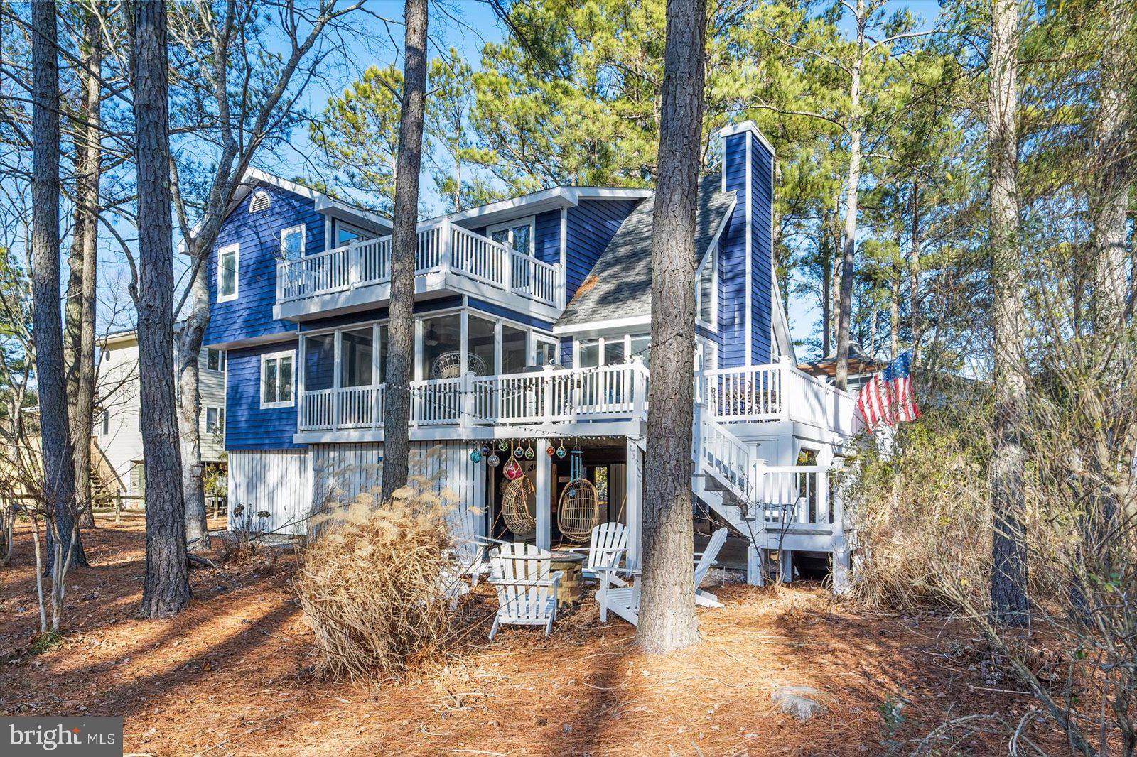 943 Pine Tree Lane Bethany Beach, DE 19930 - Photo 66 of 87 Back yard with cozy fireplace and custom lighting