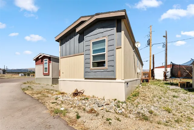 a front view of a house with parking