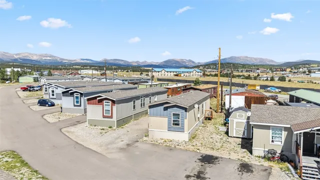 a view of a terrace with wooden floor and a ocean view
