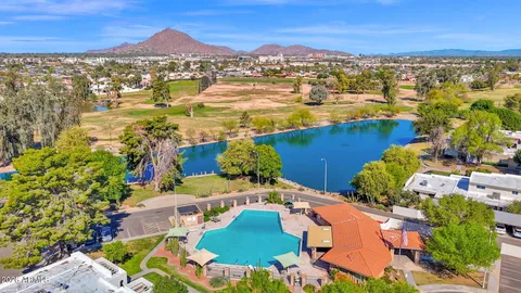a en suite bathroom with a sink and mirror