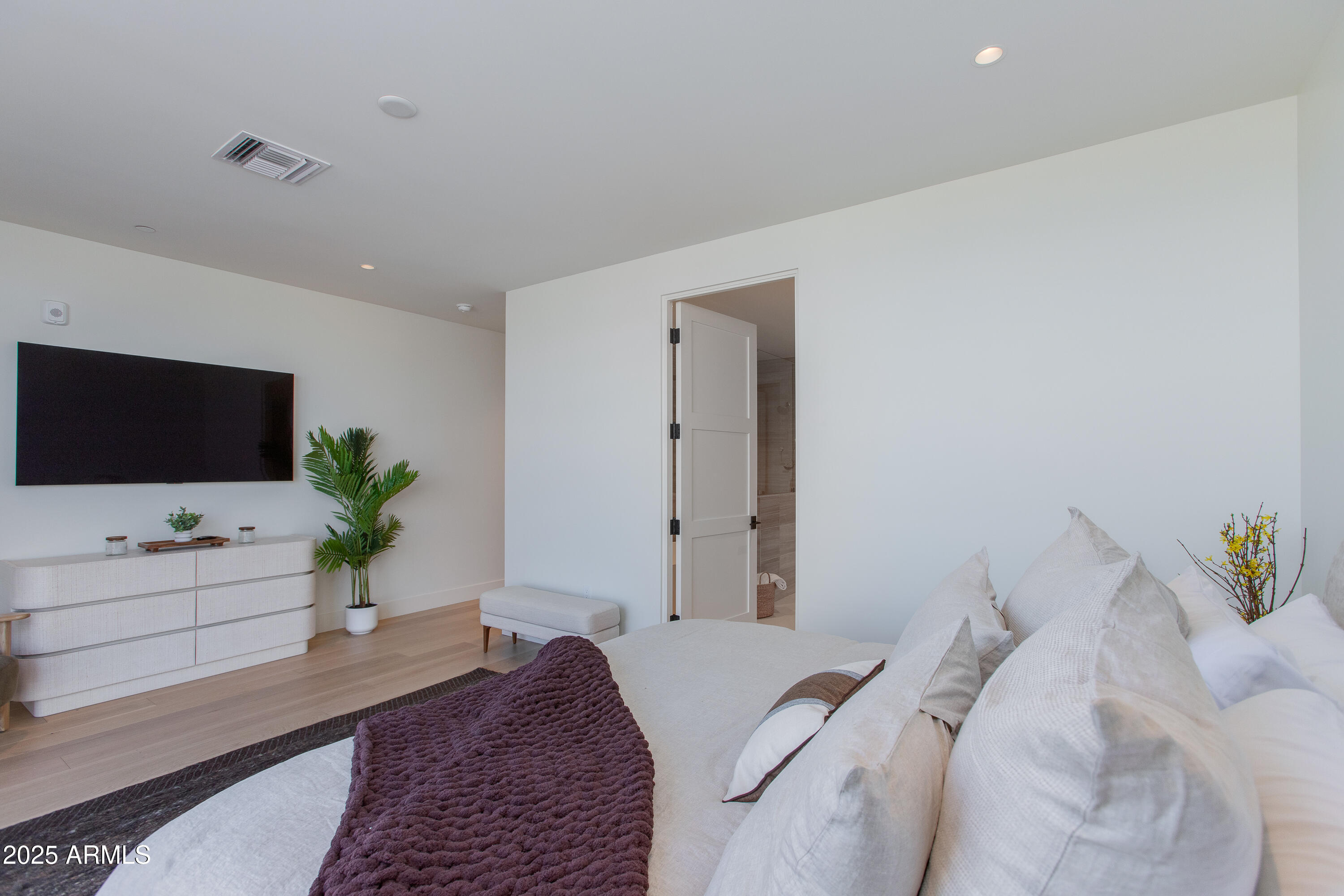5000 North Camelback Ridge Drive, Unit 206 Scottsdale, AZ 85251 - Photo 25 of 62 a bedroom with a bed and a flat screen tv
