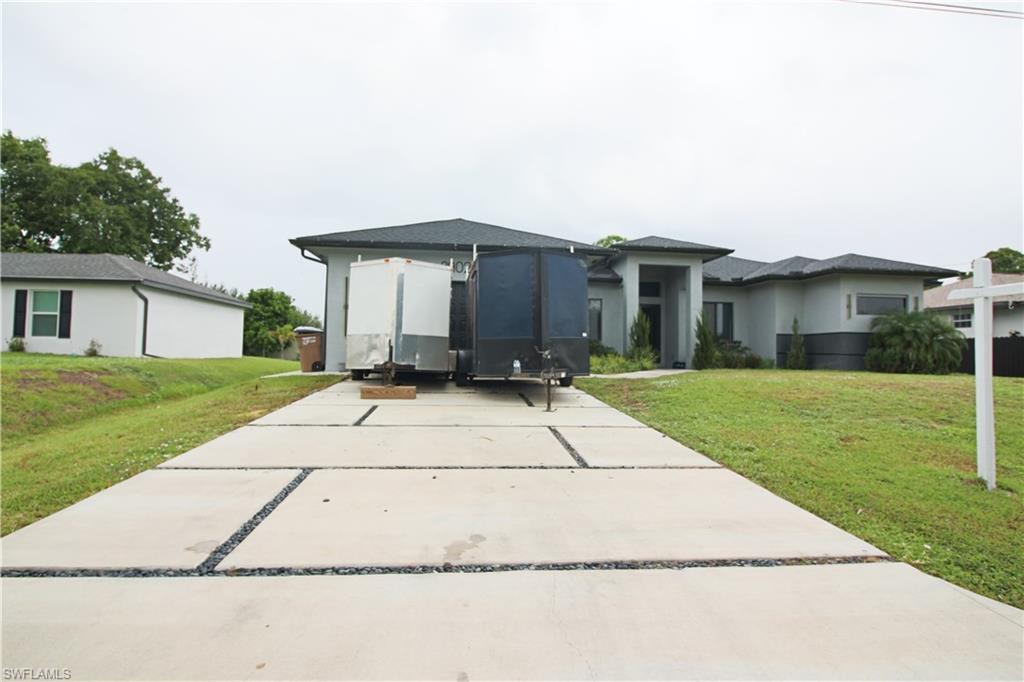 3902 4th Street Southwest Lehigh Acres, FL 33976 - Photo 3 of 34 Contemporary-style single-story residence with a concrete block construction