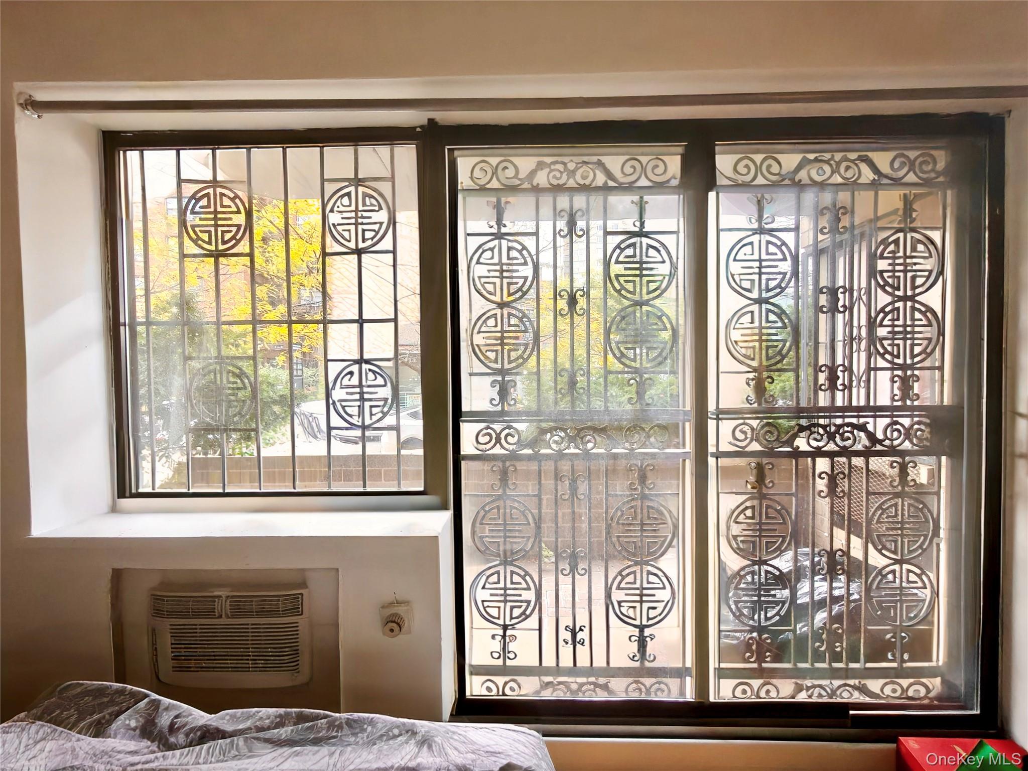 134-46 Maple Avenue, Unit 1C Queens, NY 11355 - Photo 12 of 12 a window that has a clock on it