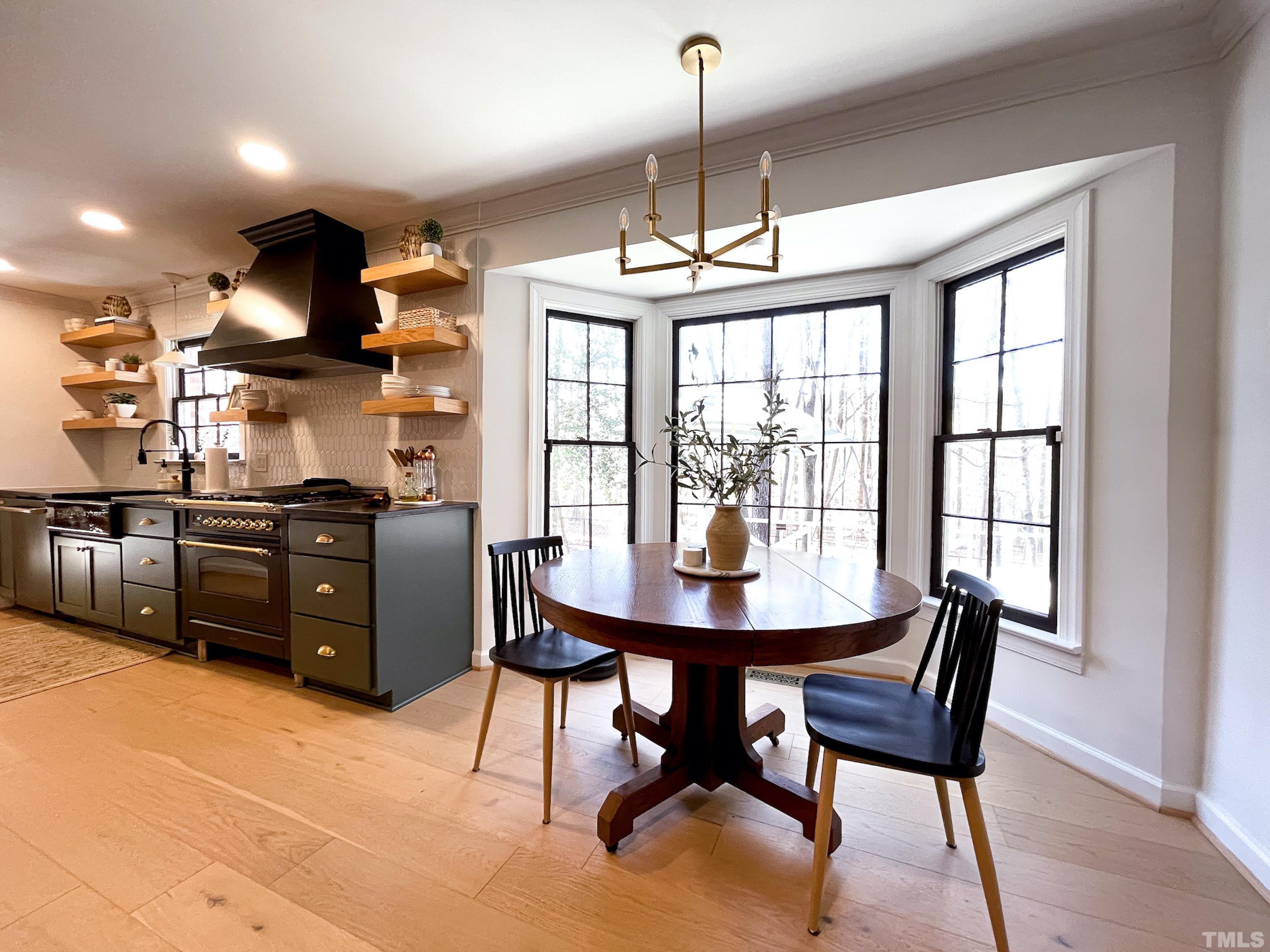 5025 Red Cedar Road Raleigh, NC 27613 - Photo 26 of 75 a view of a dining room with furniture window and outside view