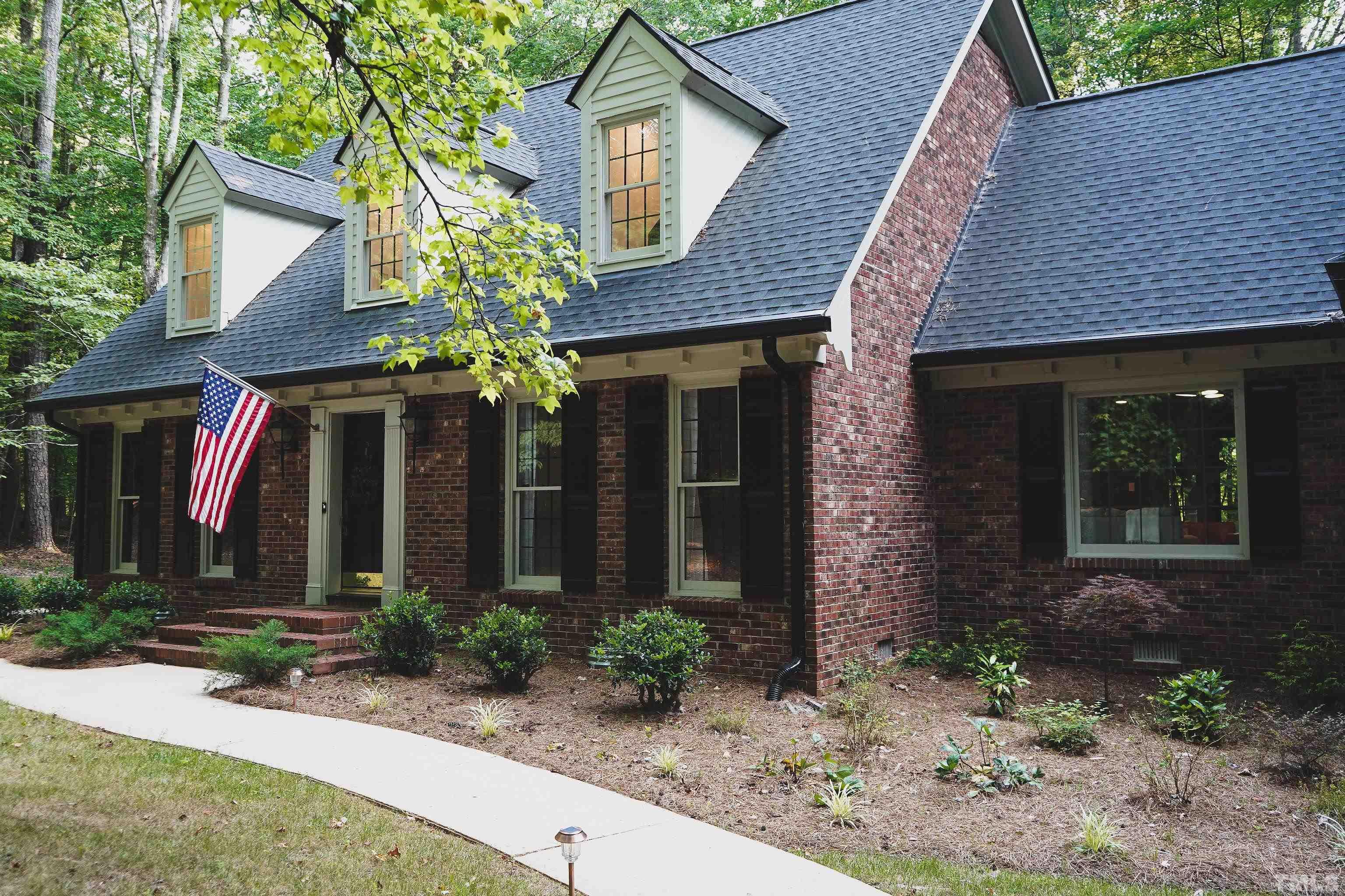 5025 Red Cedar Road Raleigh, NC 27613 - Photo 3 of 75 a front view of a house with garden