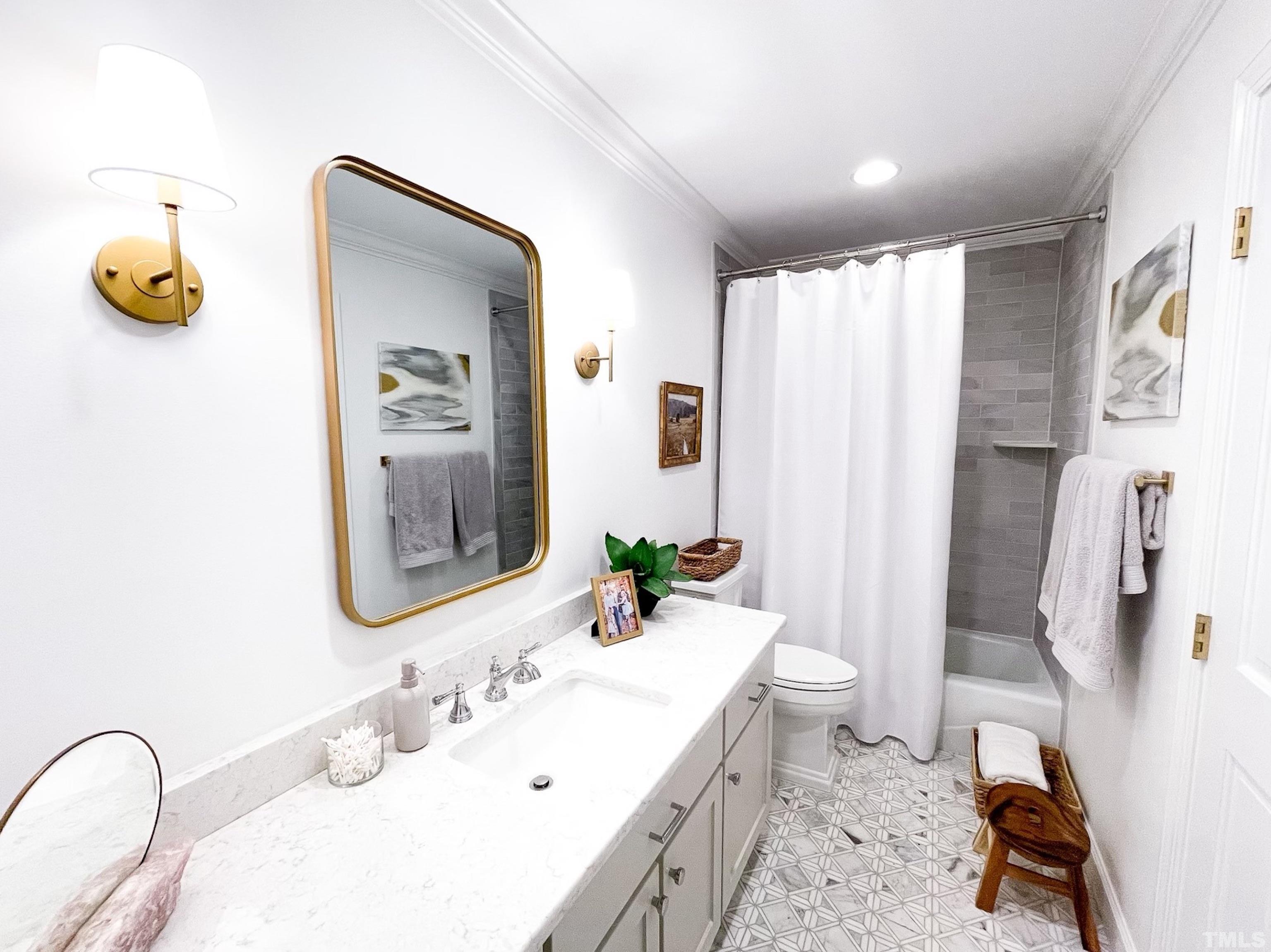 5025 Red Cedar Road Raleigh, NC 27613 - Photo 65 of 75 a bathroom with a sink toilet and shower