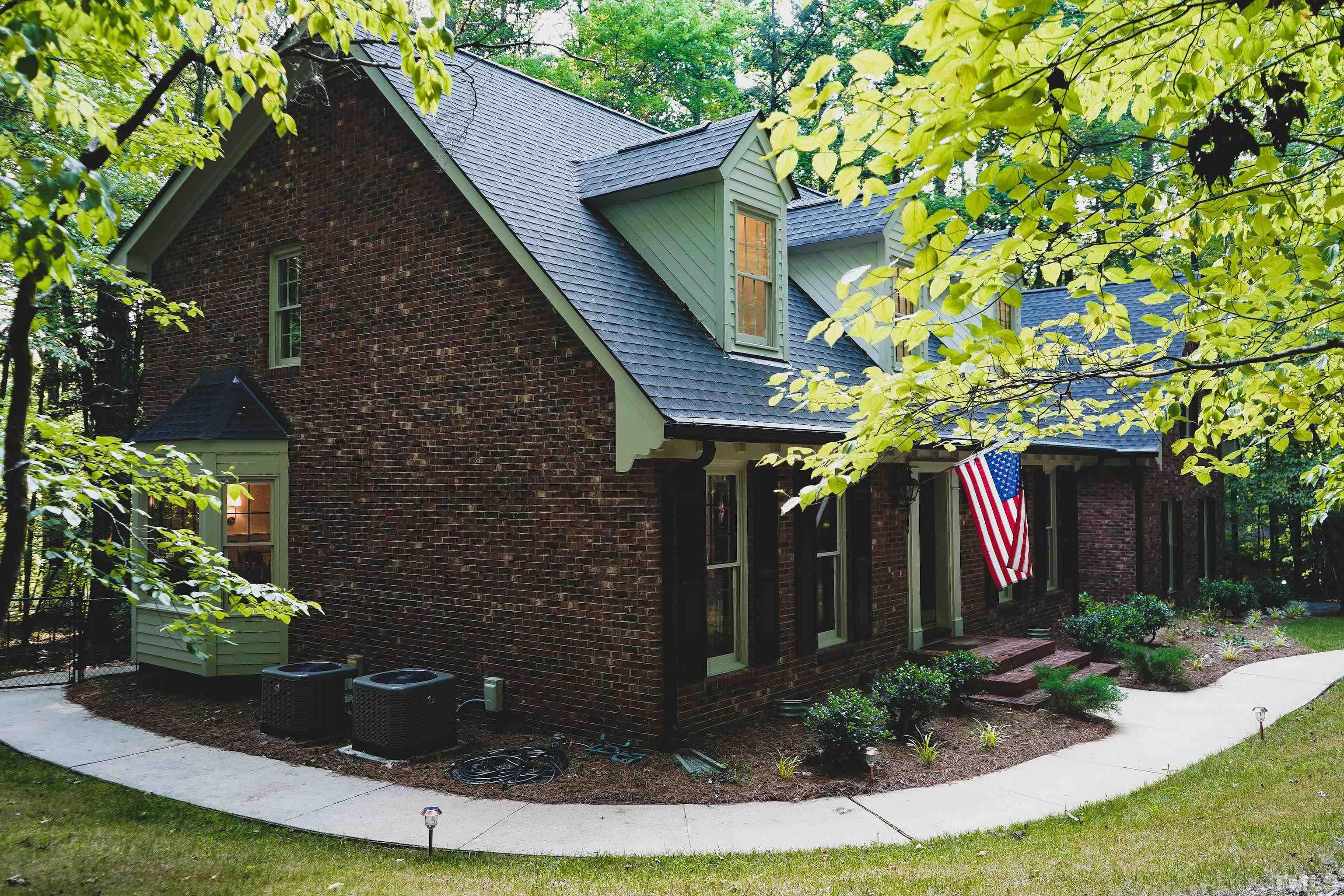 5025 Red Cedar Road Raleigh, NC 27613 - Photo 7 of 75 a front view of a house with garden