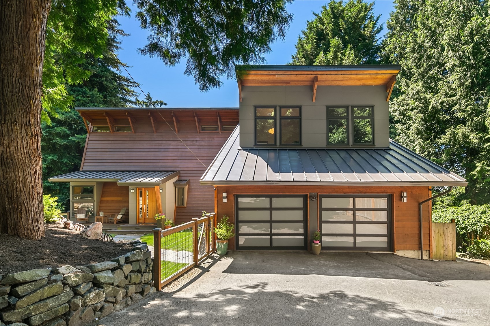 6021 West Mercer Way Mercer Island, WA 98040 - Photo 1 of 40 front view of a house with a yard