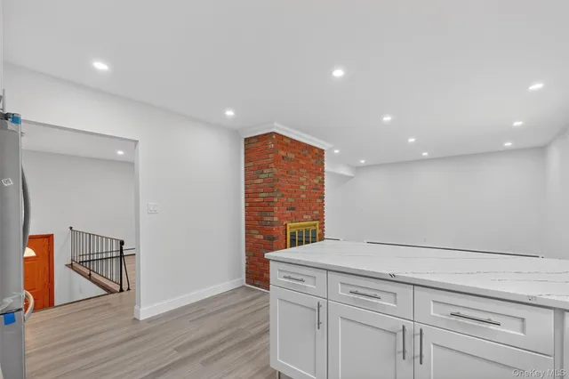 a view of hallway with wooden floor